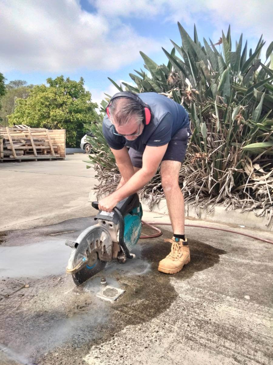 man repairing pipe